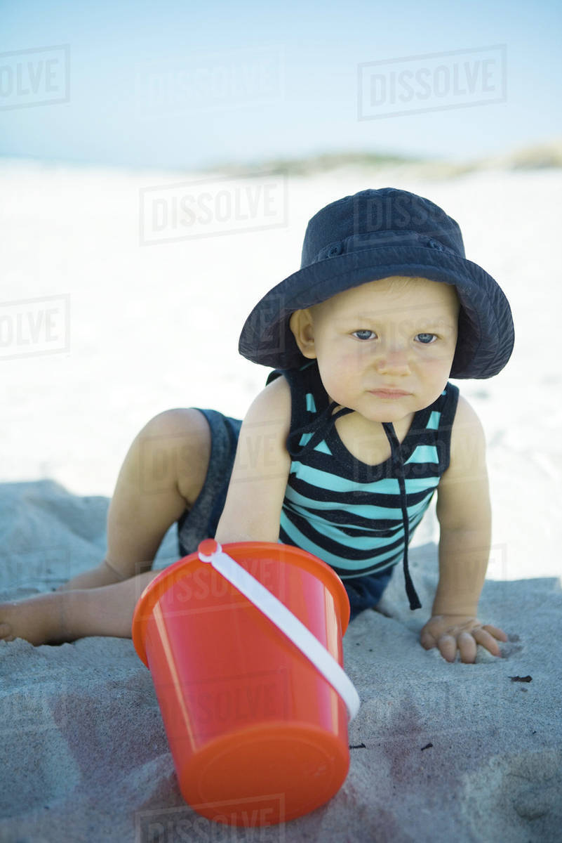 Baby playing in sand - Royalty-free Stock Photo | Dissolve