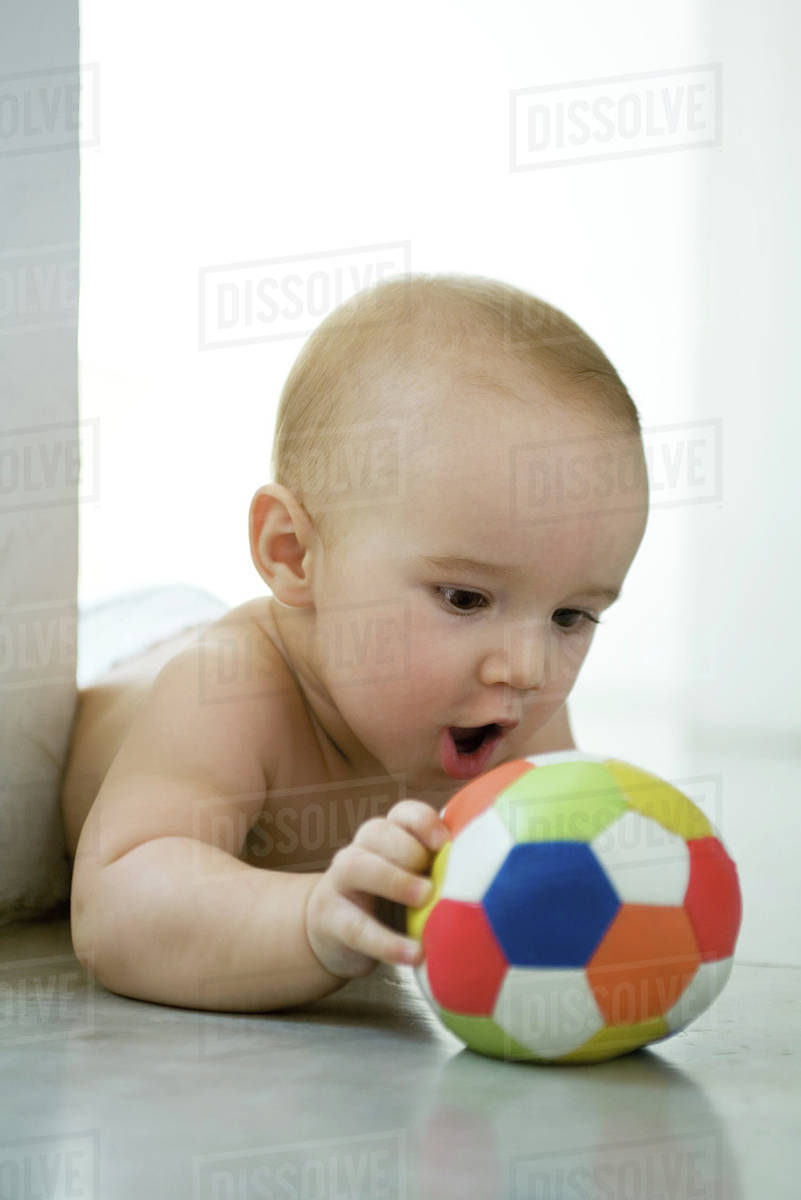 baby holding ball