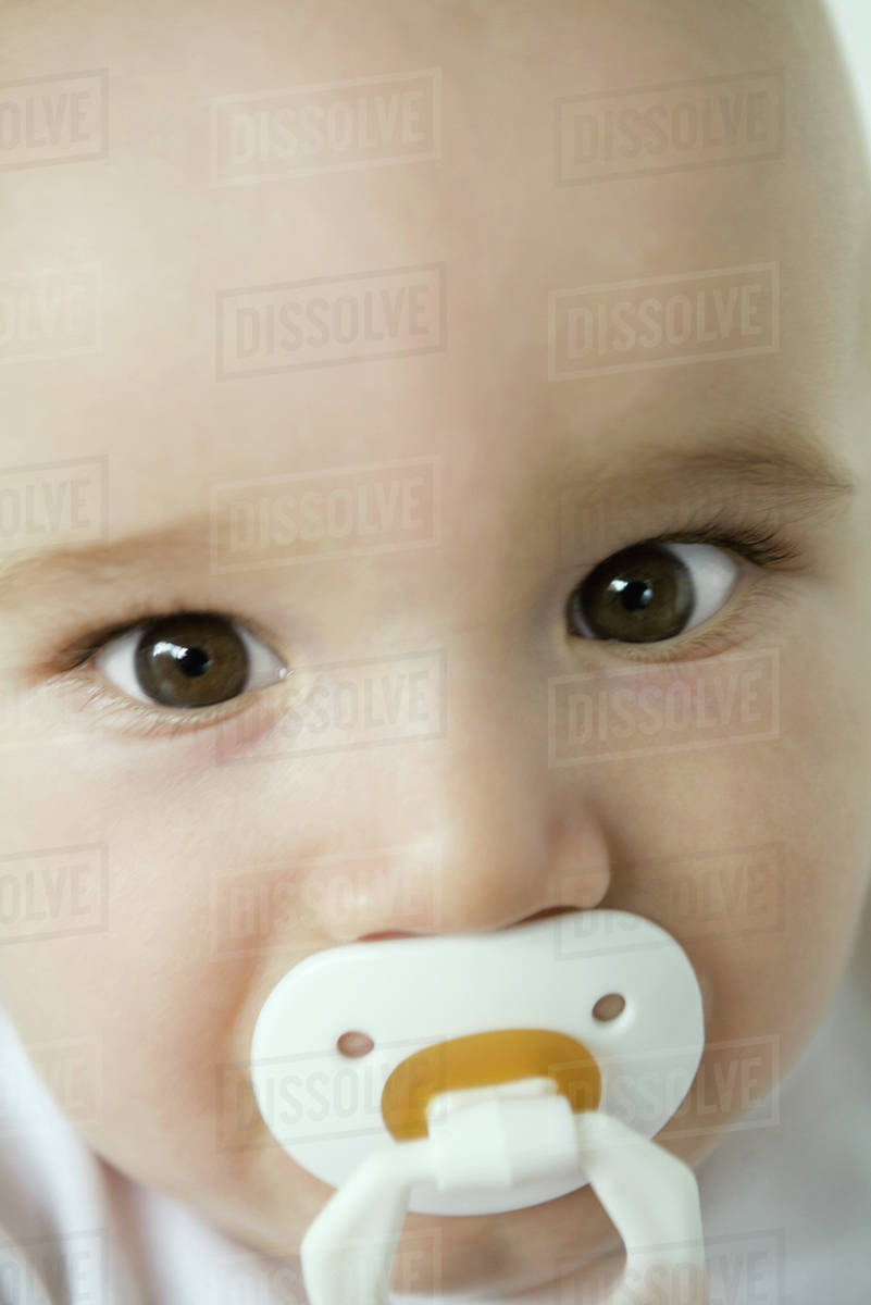 baby with pacifier in