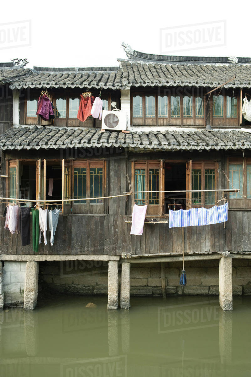 China, Guangdong Province, houses along canal Stock Photo Dissolve