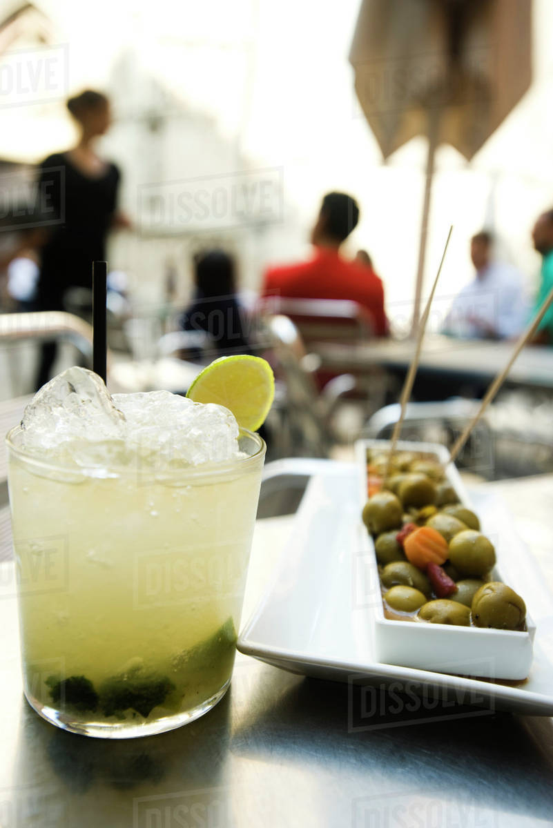 Mojito and olive tray Stock Photo Dissolve