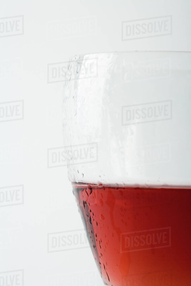 Glass of chilled rose wine, closeup Stock Photo Dissolve