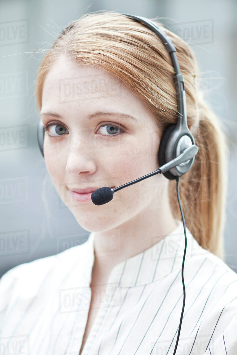 Operator wearing phone headset Stock Photo Dissolve