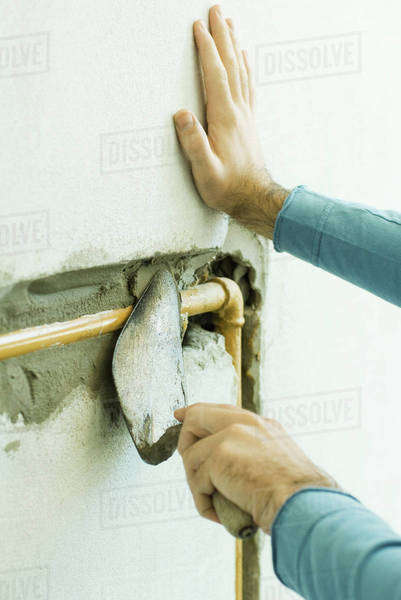 Man applying putty to pipe, cropped view of hands - Royalty-free Stock ...