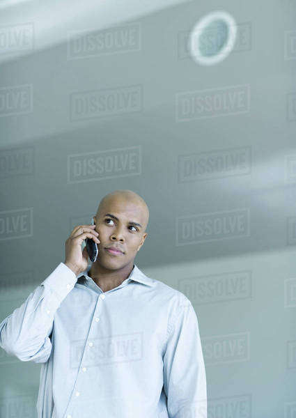 Man using cell phone - Stock Photo - Dissolve