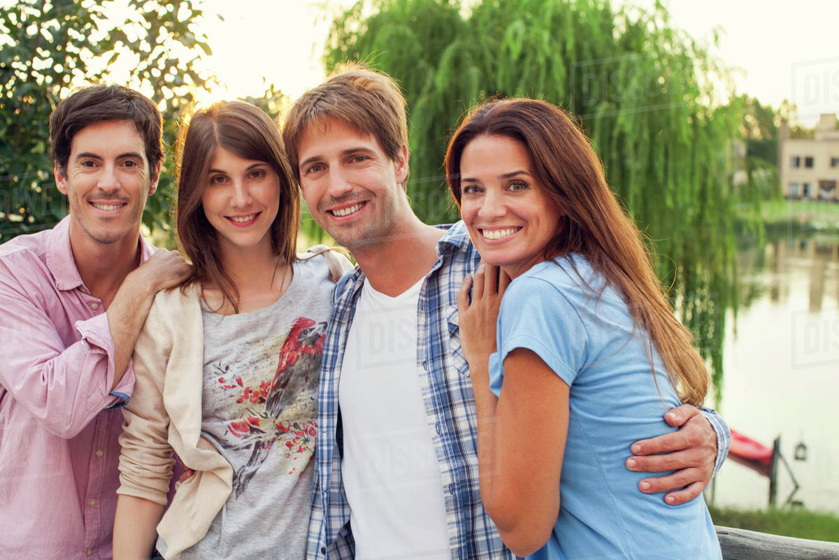 Friends posing for group photo Stock Photo Dissolve