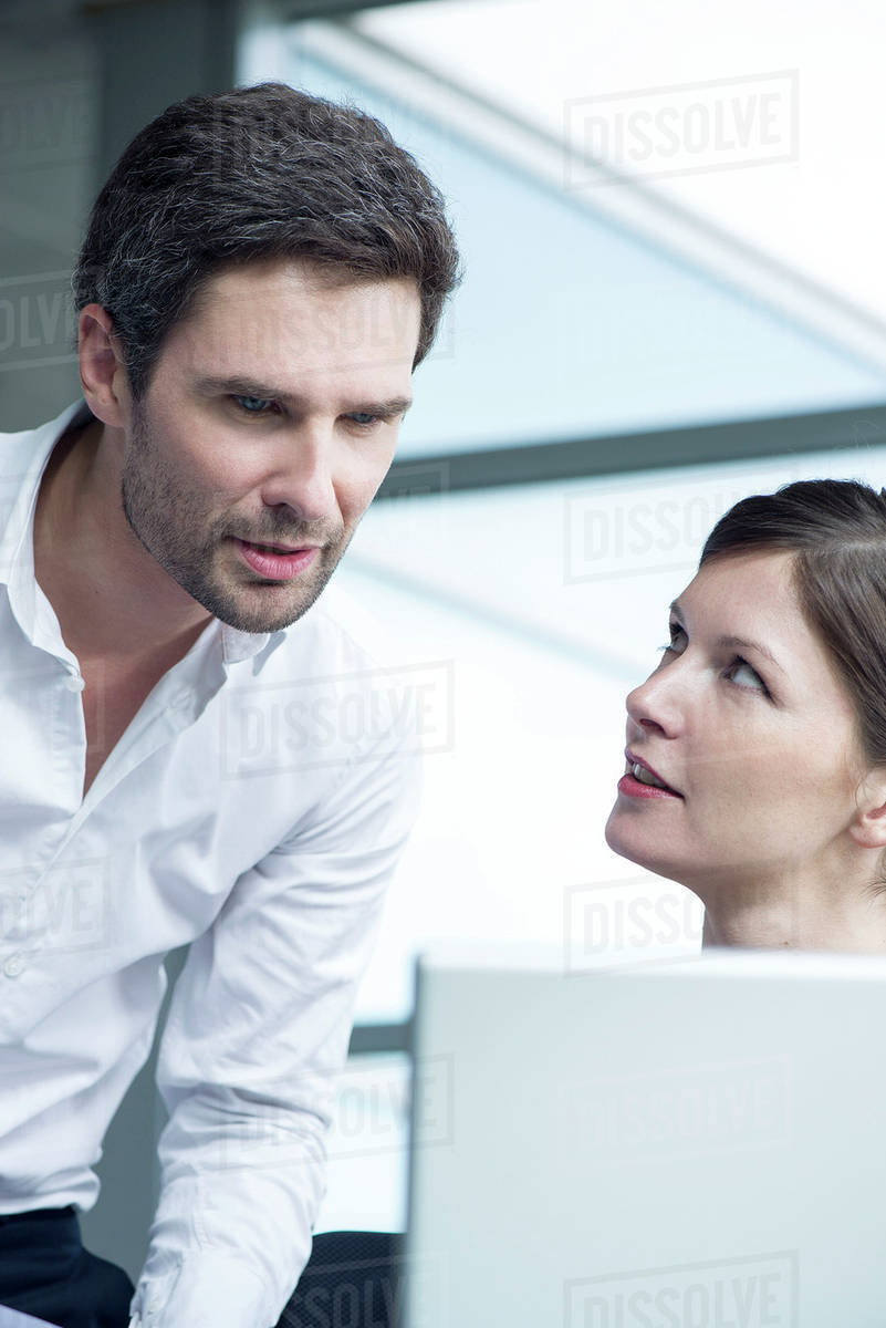 Colleagues collaborating in office - Stock Photo - Dissolve