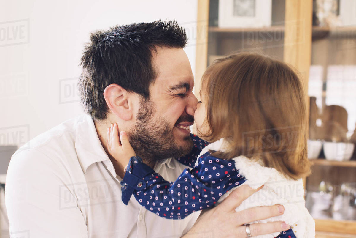 Father and daughter rubbing noses Stock Photo Dissolve