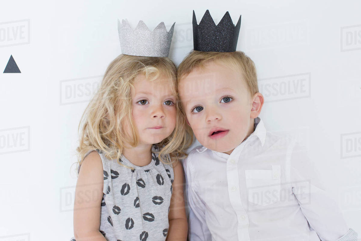 Children wearing paper crowns Stock Photo Dissolve