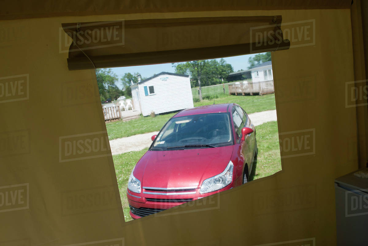 Parked car viewed through window Stock Photo Dissolve