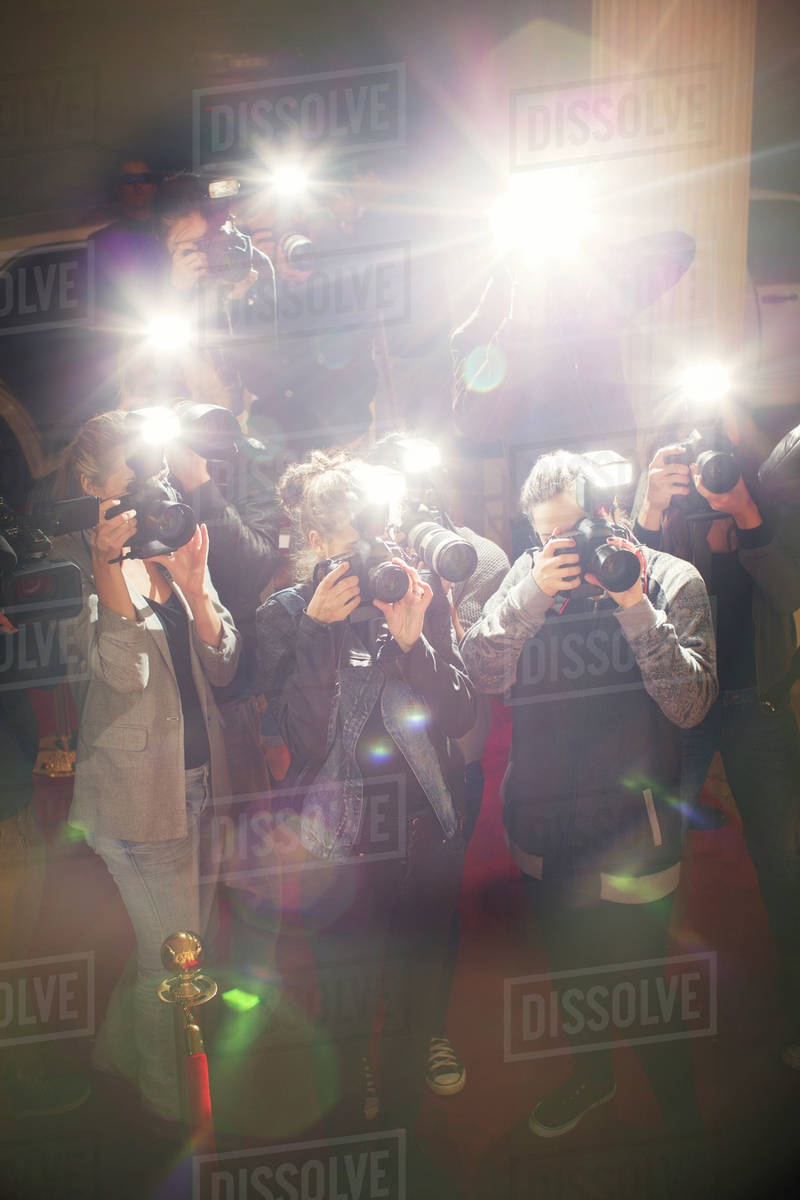 Lens flare flash from paparazzi photographers cameras - Stock Photo ...