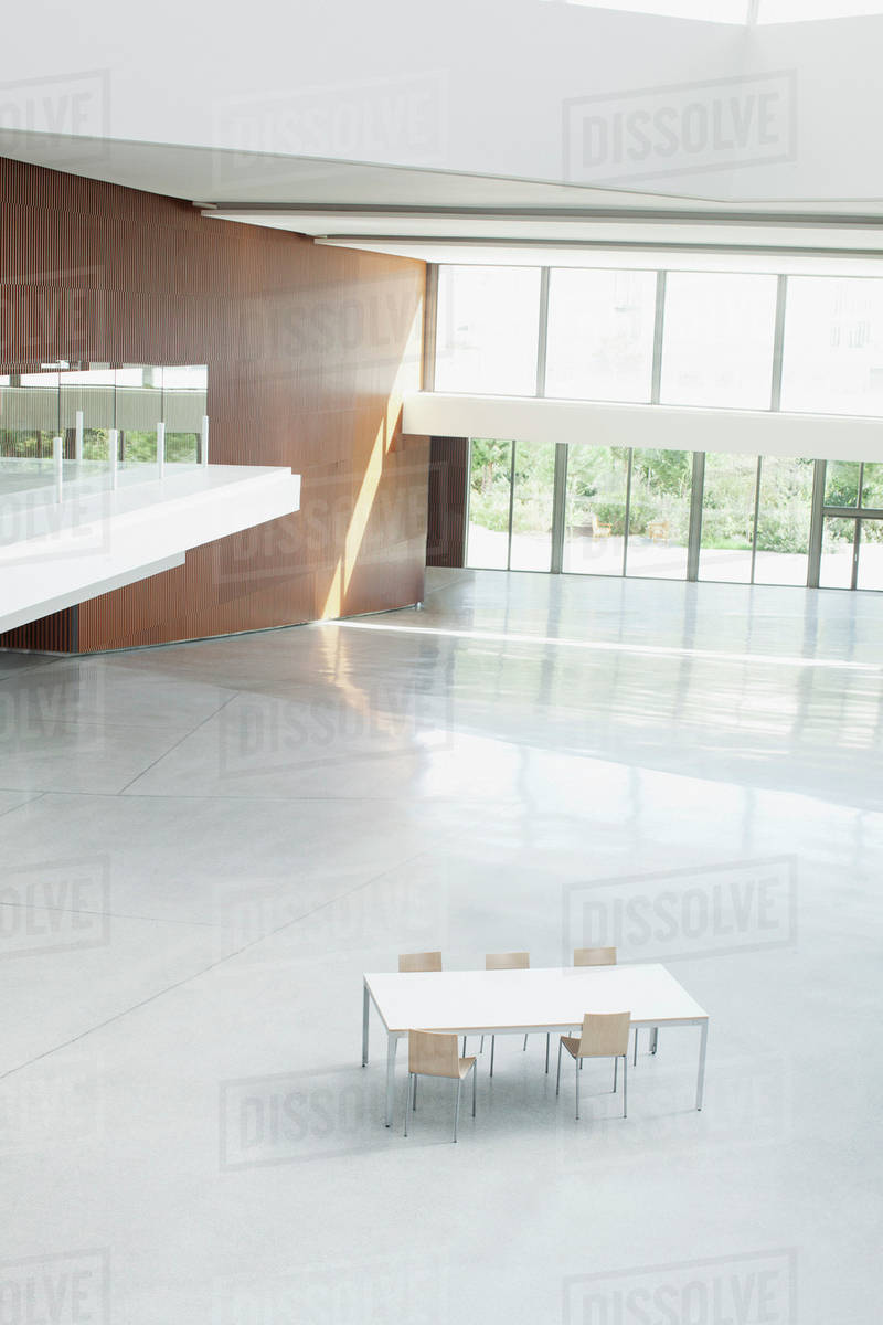 Table And Chairs In Empty Office Lobby Stock Photo