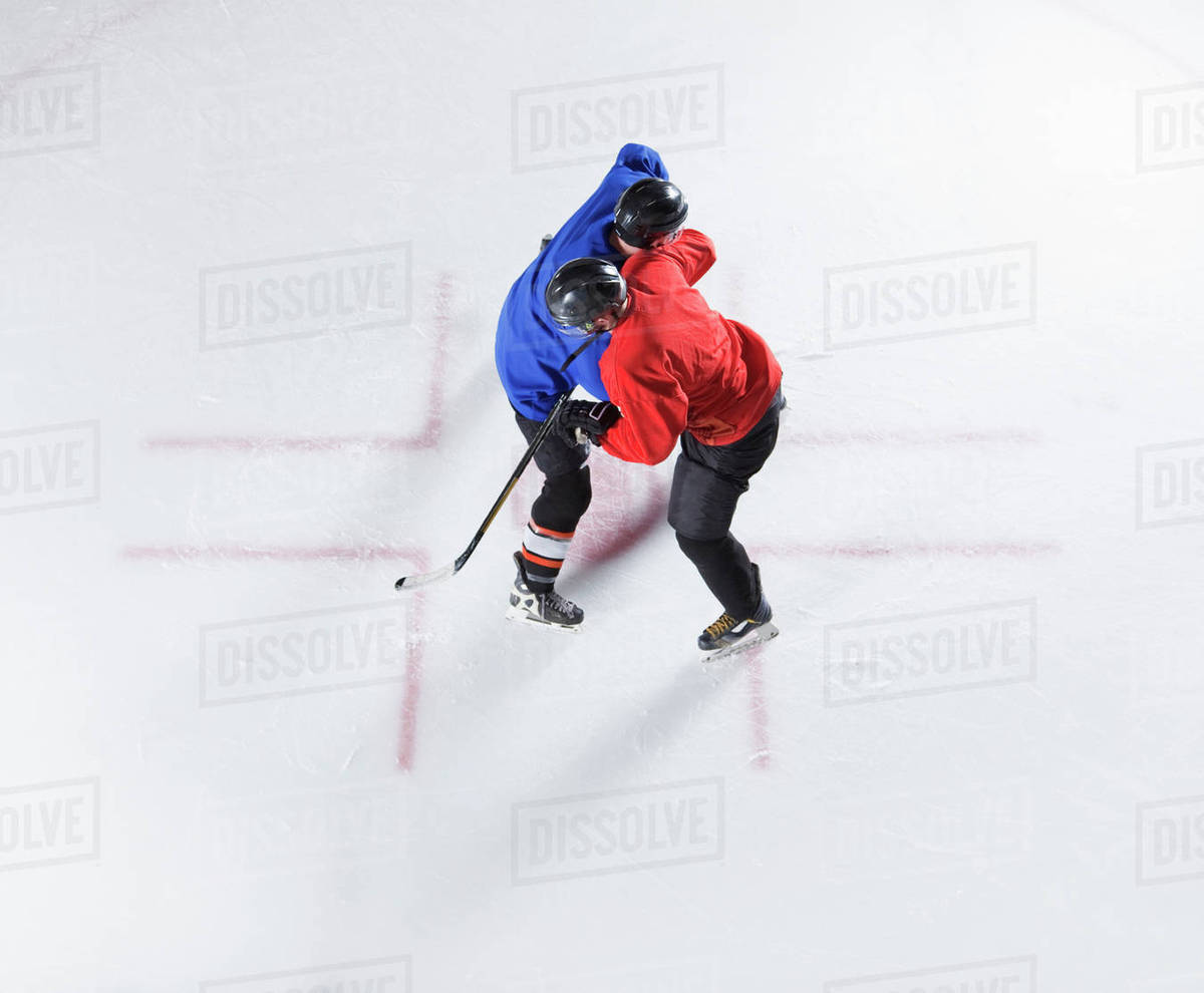 Overhead view hockey opponents colliding Stock Photo Dissolve