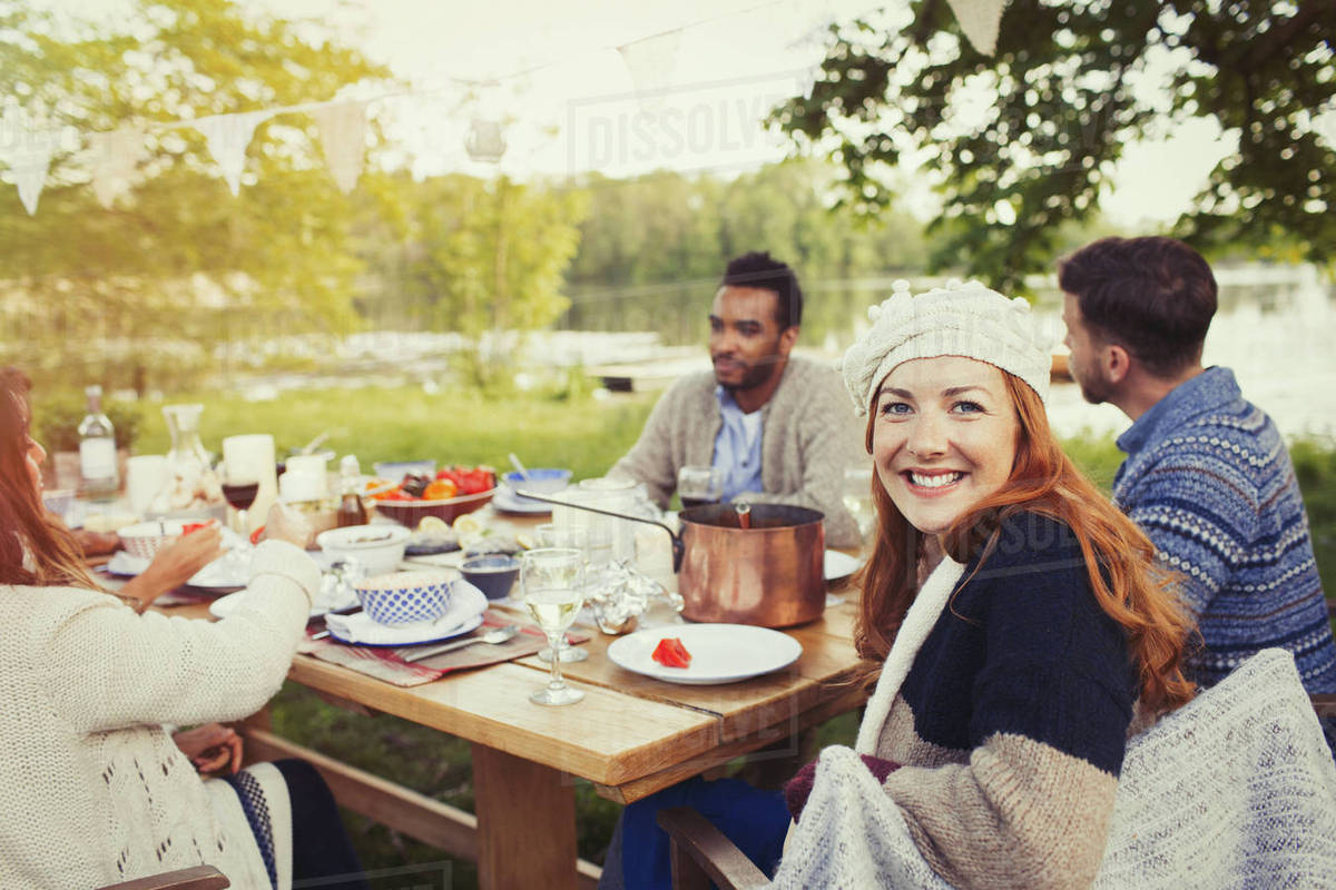 Portrait Smiling Woman Enjoying Lunch At Lakeside Patio Table Portrait Smiling Woman Enjoying Lunch At Lakeside Patio Table