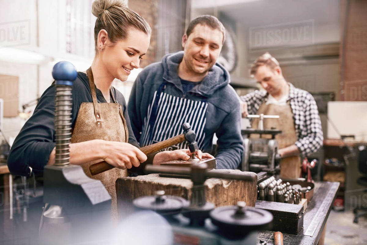 Jewelers using equipment in Stock Photo Dissolve