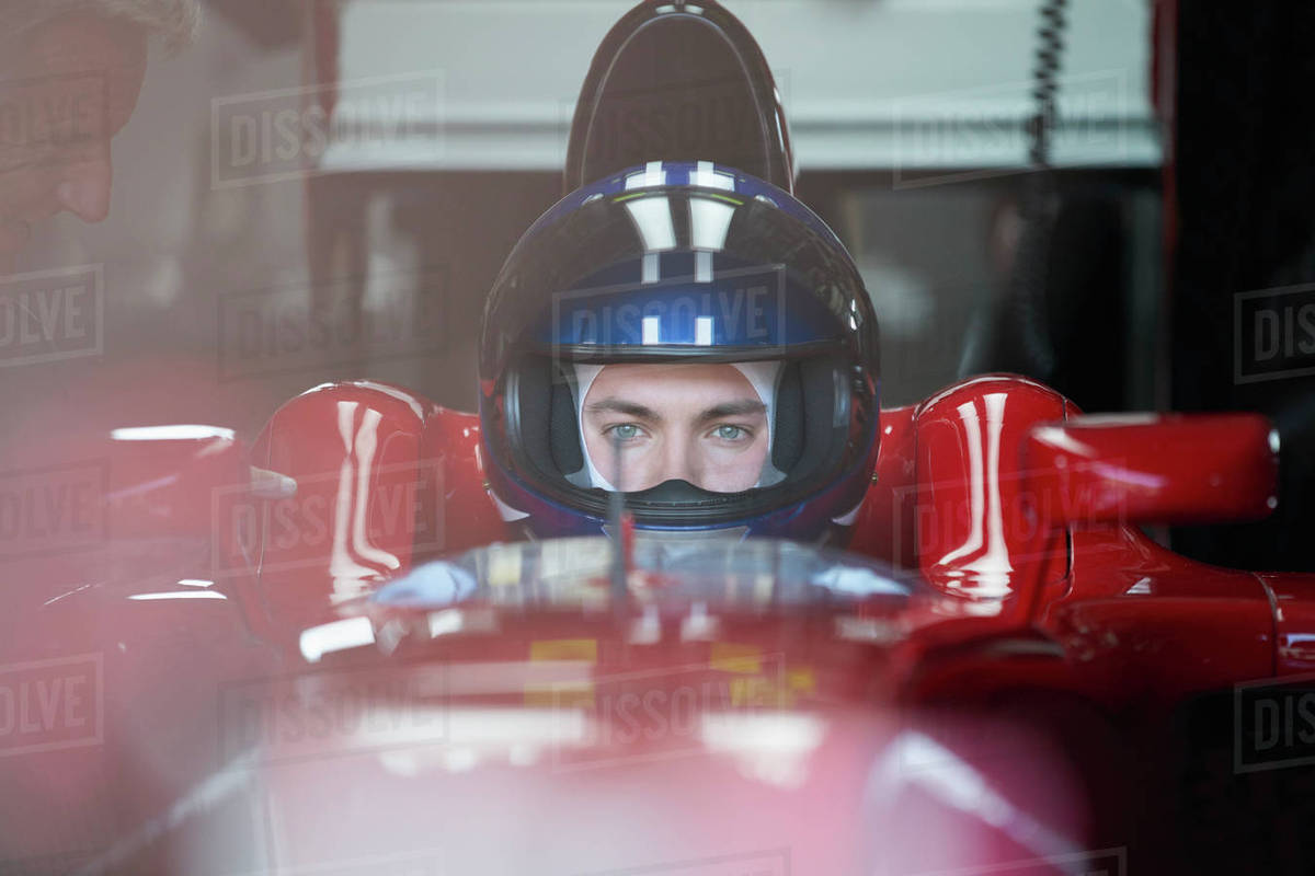 Focused formula one race car driver wearing helmet Royalty-free stock photo