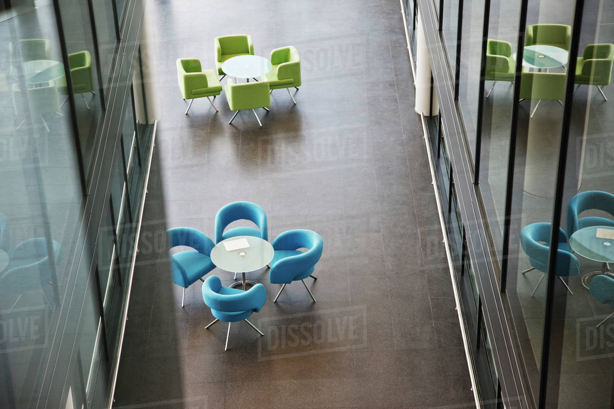 Chairs and tables in office lobby area Stock Photo Dissolve