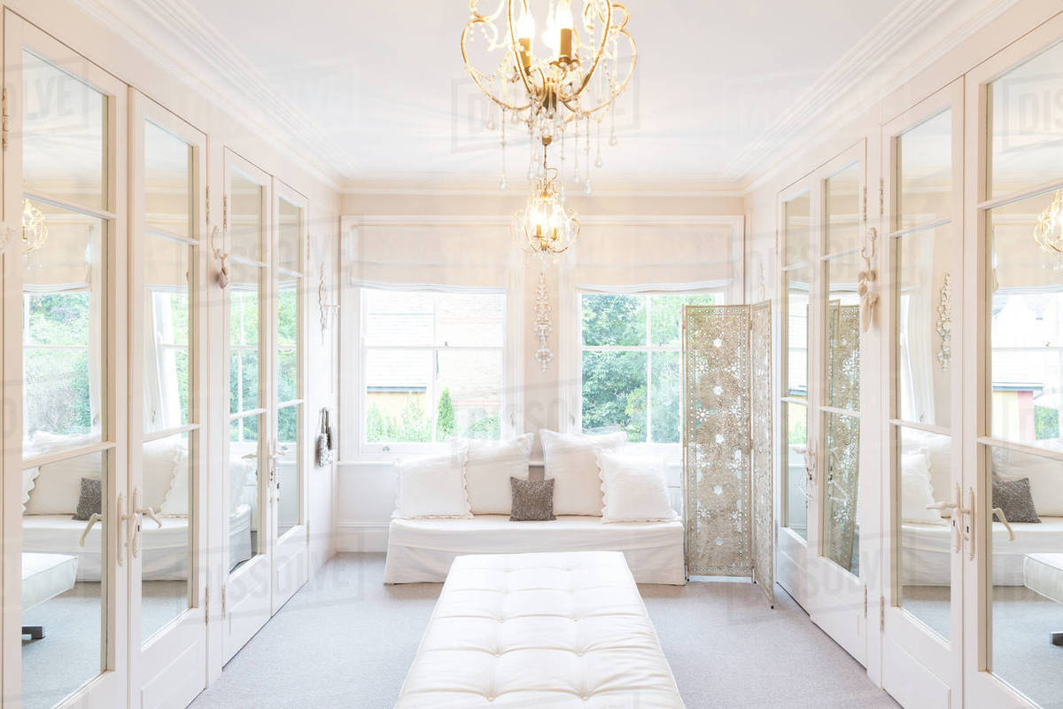 White, luxury home showcase interior dressing room with mirrored closets Royalty-free stock photo