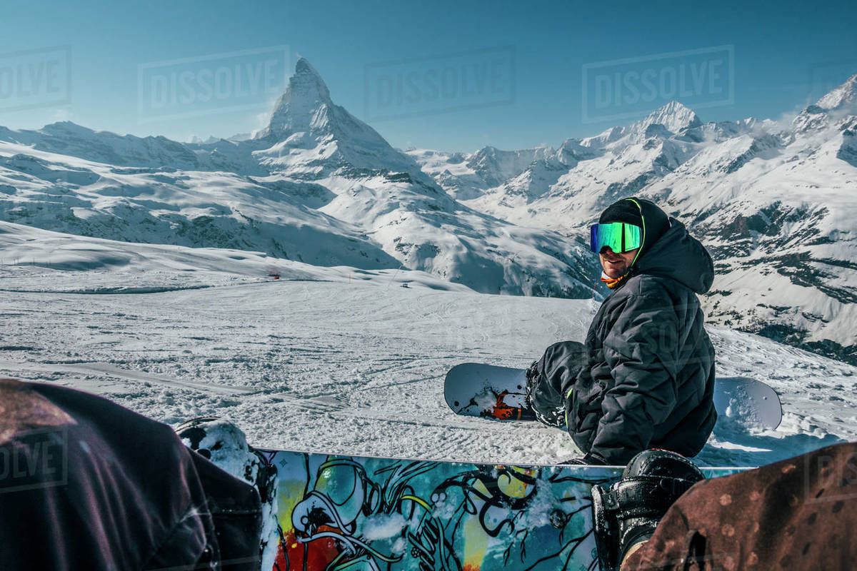 Personal perspective snowboarders on snowy ski slope, Zermatt, Switzerland Royalty-free stock photo