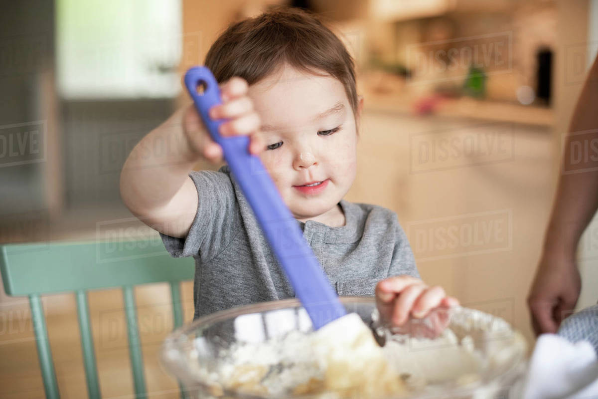 Cute toddler girl baking Stock Photo Dissolve