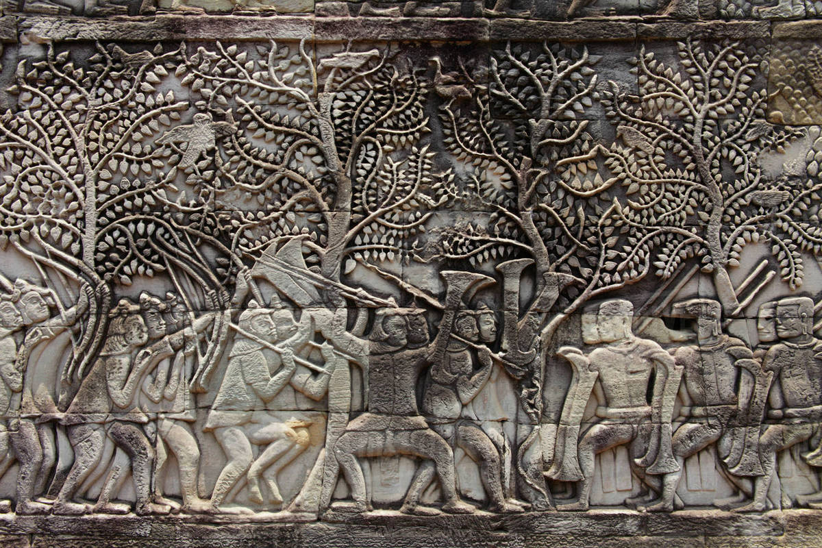 Stone carvings on the wall of Angkor Wat, Camobia Stock Photo Dissolve