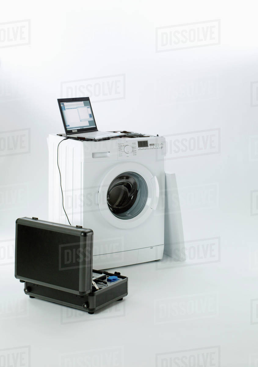 A washing machine being serviced Stock Photo Dissolve