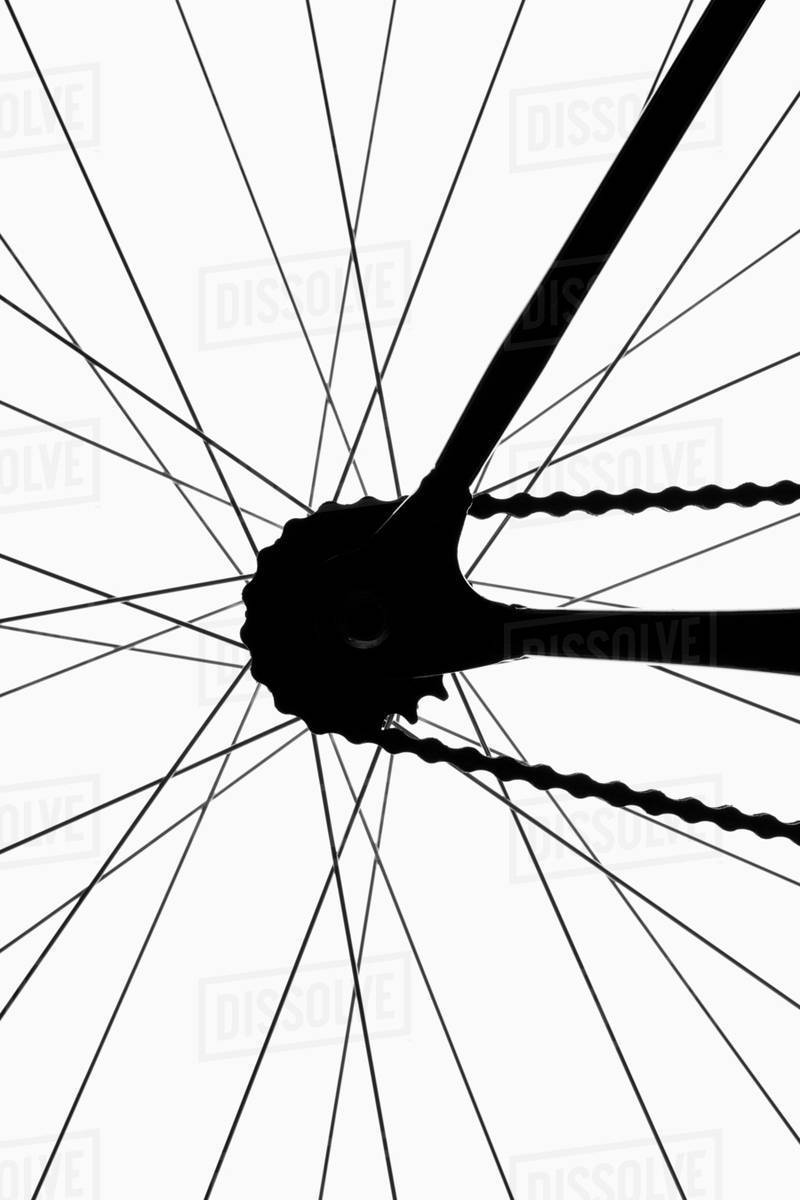 Detail of a bicycle wheel, back lit, studio shot Stock Photo Dissolve