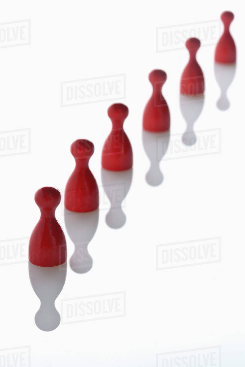 Red game pieces in a row Stock Photo Dissolve