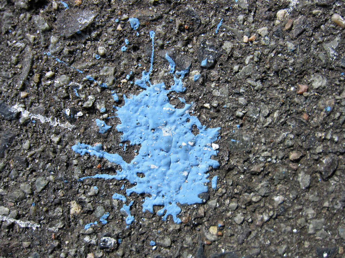 Paint splash on tarmac Stock Photo Dissolve