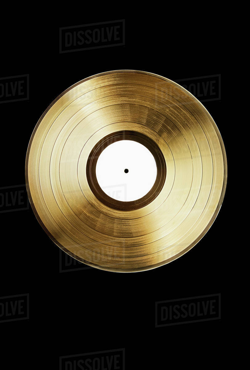 A gold record on a black background - Stock Photo - Dissolve