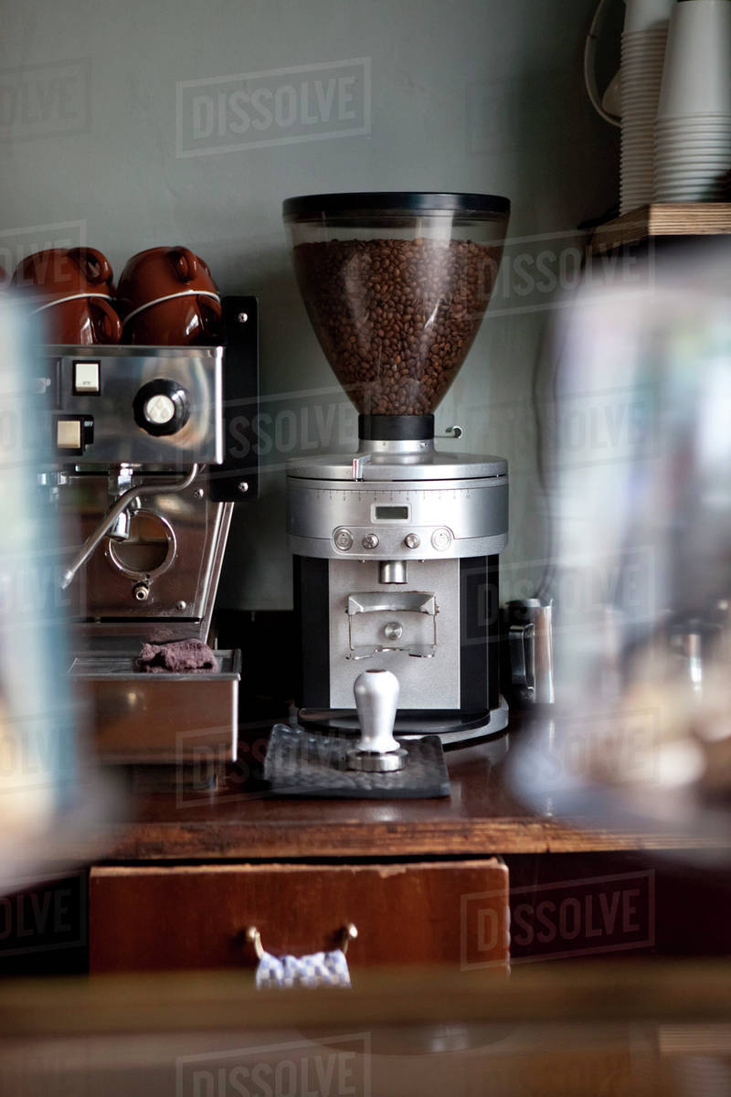 An Coffee Bean Grinder Next To Espresso Maker In A An Coffee Bean Grinder Next To Espresso Maker In A