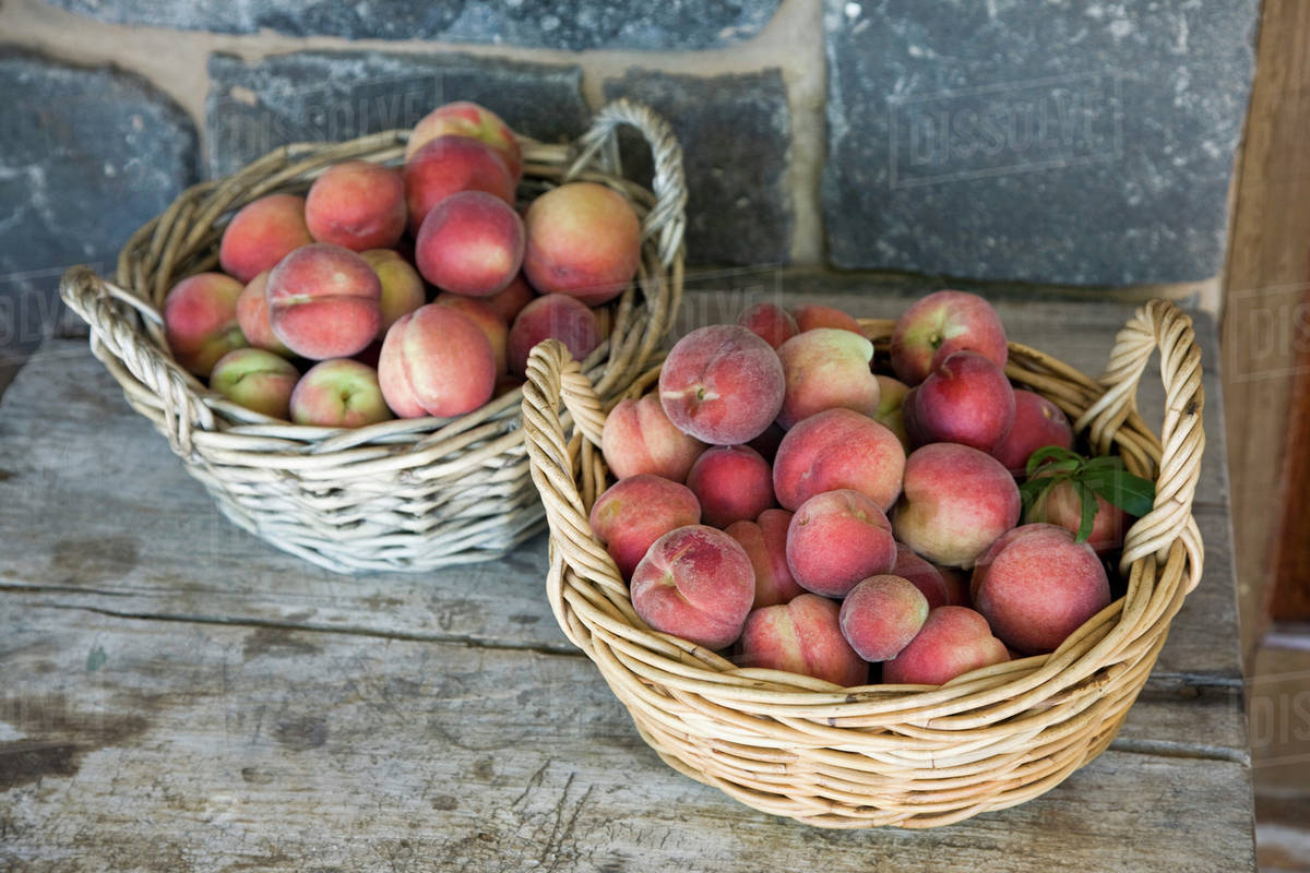 Baskets of peaches Stock Photo Dissolve