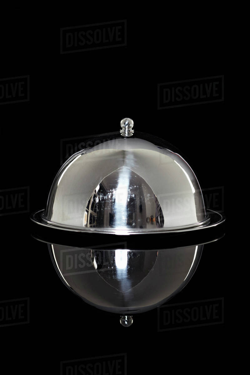 A silver platter with a lid - Stock Photo - Dissolve