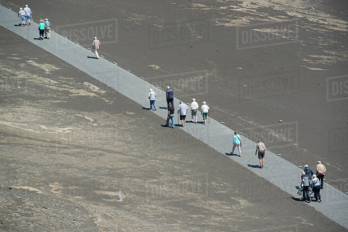 Tourists walking along volcano path, Faial Island, Azores, Portugal Royalty-free stock photo