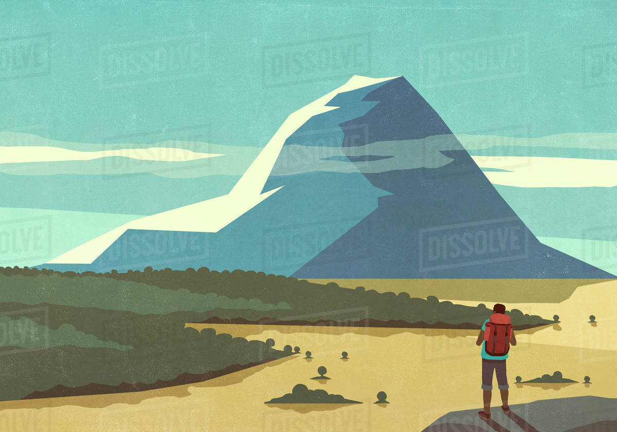 Male backpacker enjoying sunny scenic mountain landscape view Royalty-free stock photo