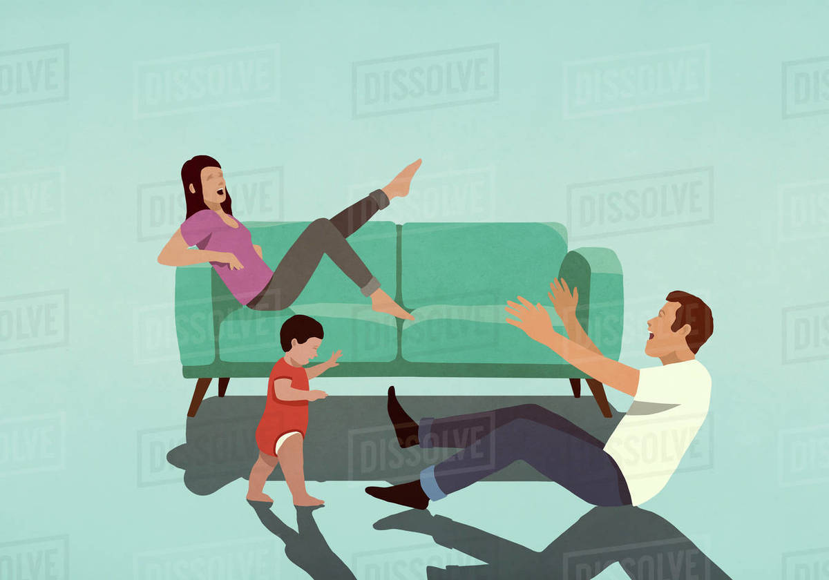 Happy couple watching baby son take first steps in living room Royalty-free stock photo