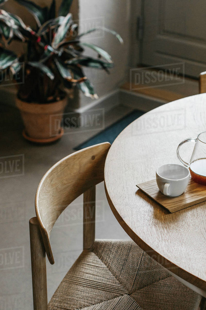 Tea and teacup on wooden dining table Stock Photo Dissolve